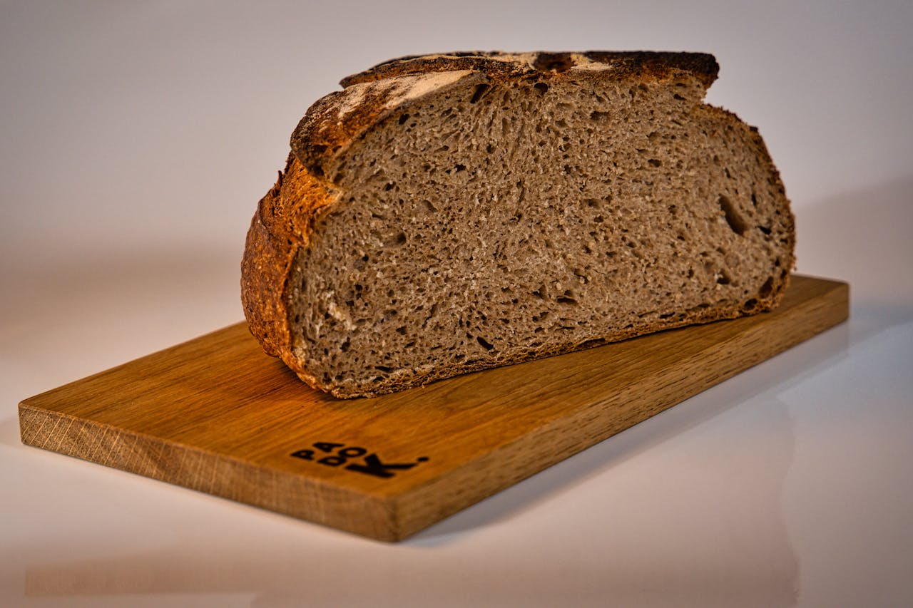 A slice of rustic artisan bread on a wooden board, capturing the essence of traditional baking in a Berlin bakery.