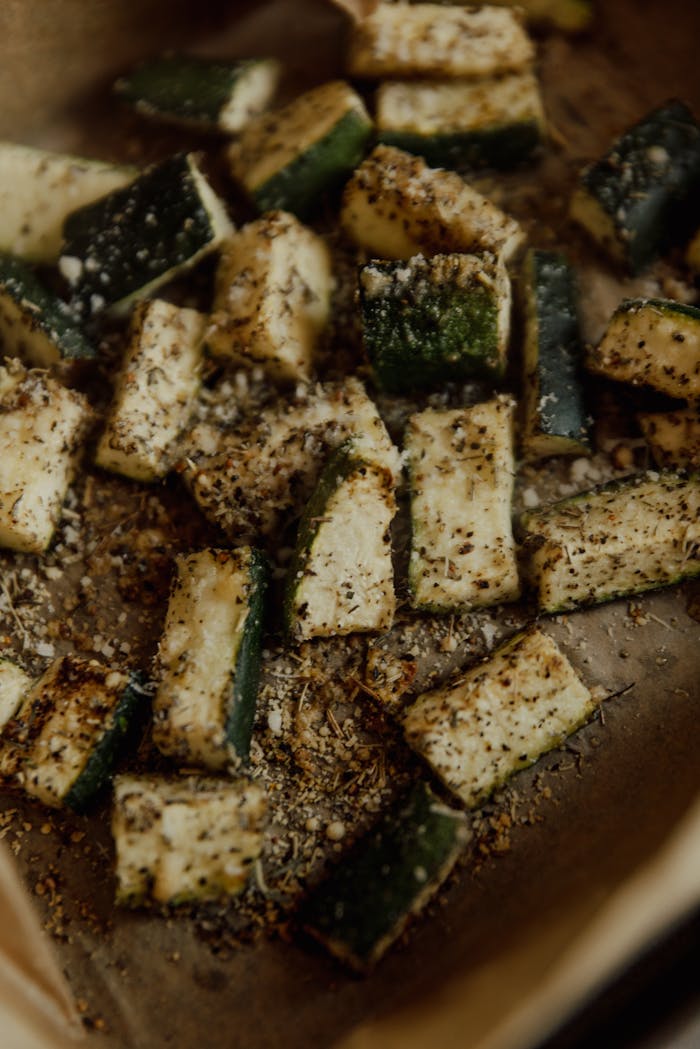 services-02 Deliciously seasoned baked zucchini chunks, ideal for vegan and vegetarian diets.